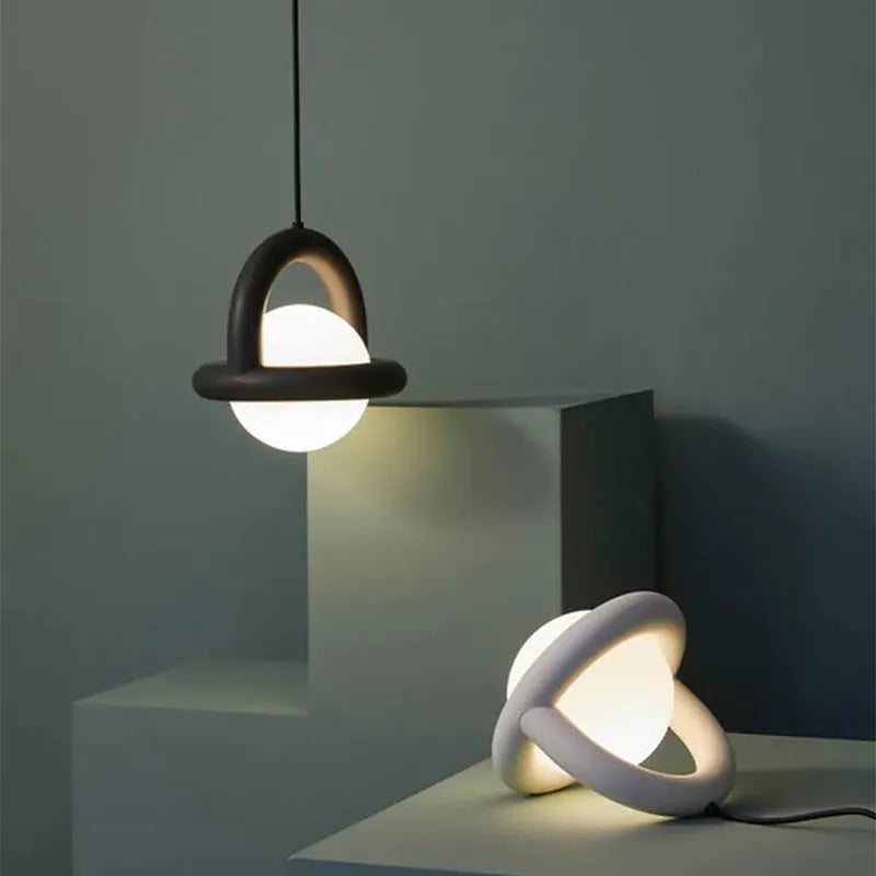 Matte black Nordic hanging pendant bedside lamp with a fabric cord.