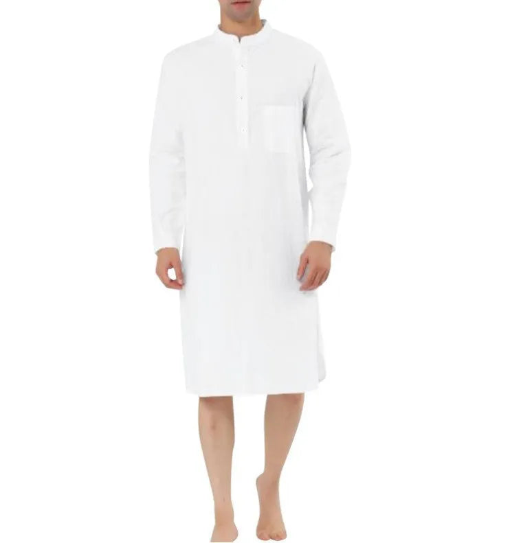 Man wearing a light blue cotton shirt robe with a simple chest pocket.