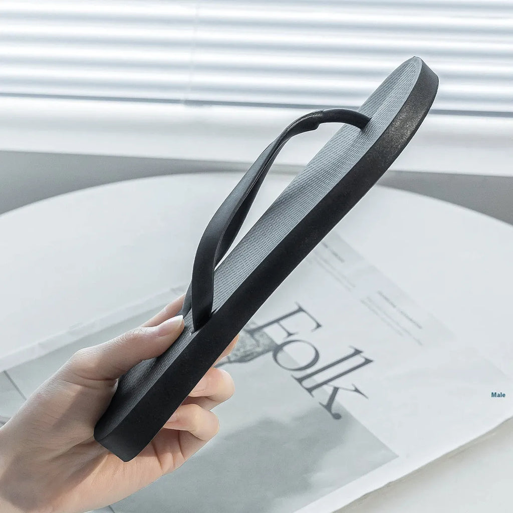 Foldable beach slippers with non-slip PVC sole in black colour showing hollow out design
