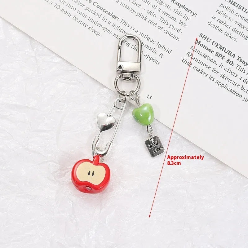 Fruit-themed mobile phone bag pendant keychain with resin apple and strawberry designs