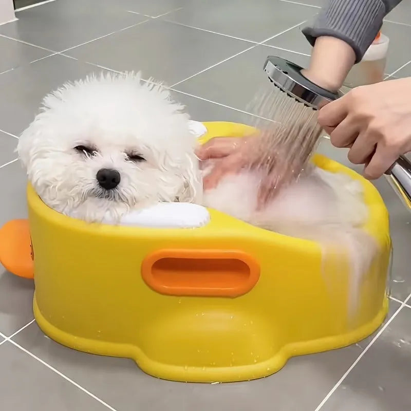 Blue PVC duck-shaped foldable bathtub for washing dogs and cats on a flat surface