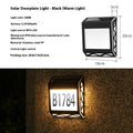 Black solar-powered doorplate light with LED digital numbers for outdoor house address illumination