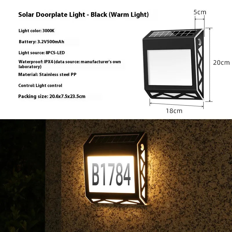 Black solar-powered doorplate light with LED digital numbers for outdoor house address illumination