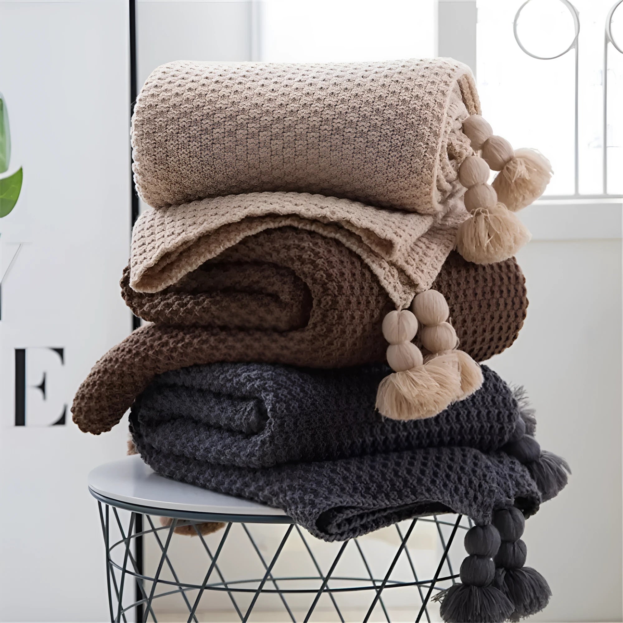 Nordic fringe knit ball acrylic blanket measuring 130×170cm in beige colour