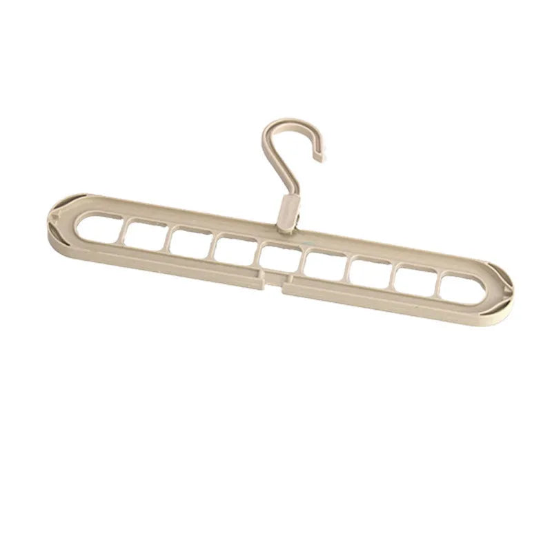 Multifunctional plastic hanger with nine holes for trousers, shown in folded position for space saving