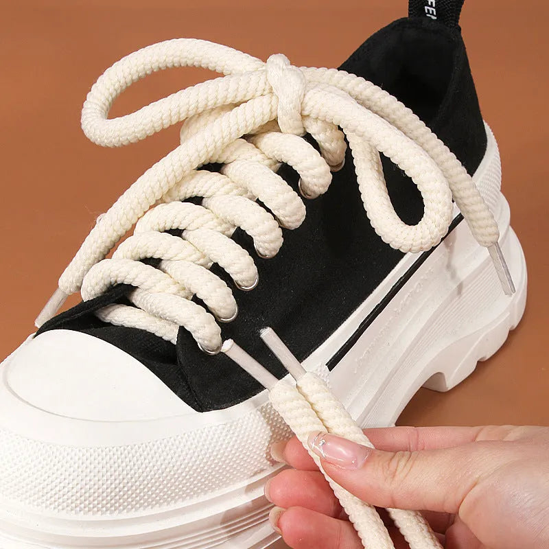 Solid colour round woven shoelaces for bread shoes in white, beige, and black.