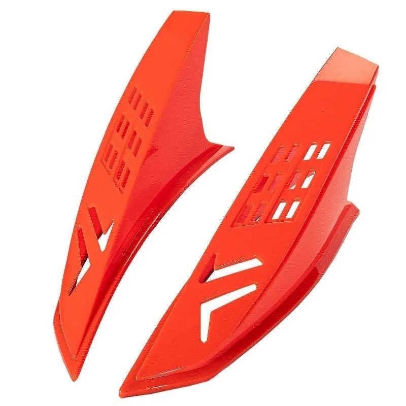 A pair of coloured adhesive-backed horns for decorating a child's motorcycle or ski helmet.