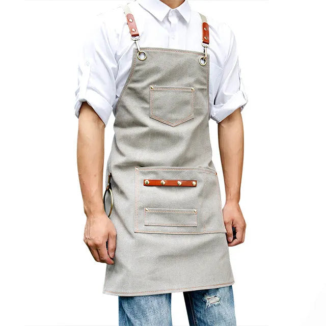 Canvas apron with cross back straps in camel colour for café or baking work