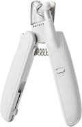 White pet nail clippers with LED light, transparent guard, and a nail file on a table