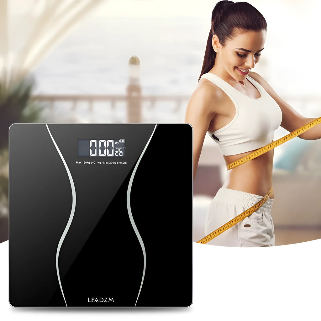 Matte black electronic body scale with digital display showing weight measurement