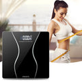 Matte black electronic body scale with digital display showing weight measurement