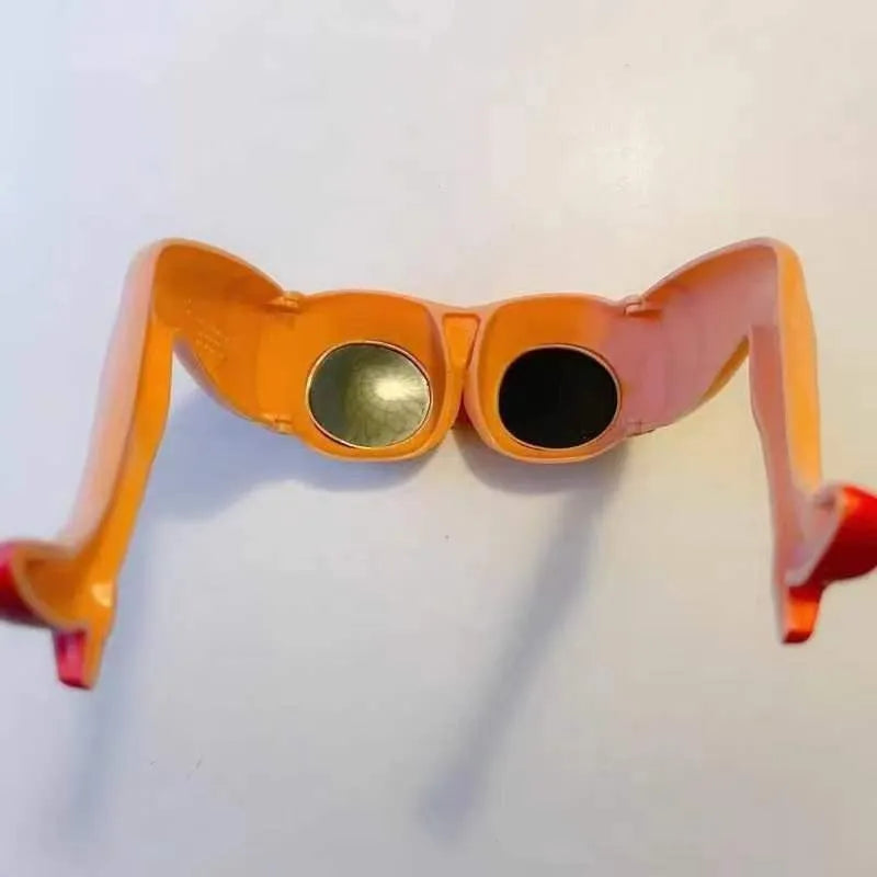 Orange novelty sunglasses with a personality leg and hip design on the plastic frame.