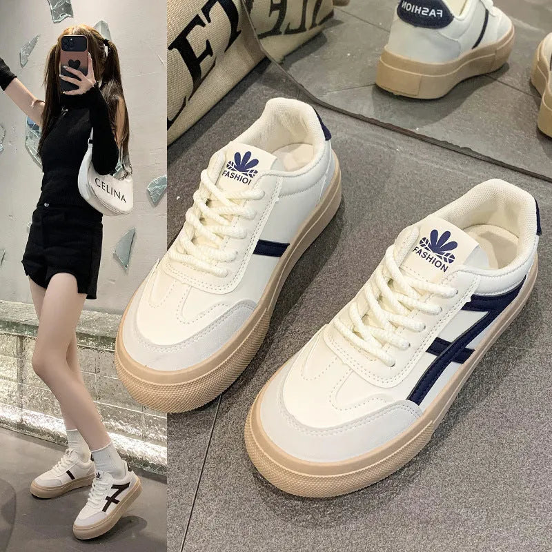 Blue and brown low-top lace-up board shoes with patent leather upper and flat rubber sole.