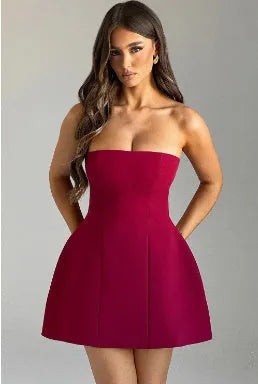 Women's short backless A-line tube dress in a solid colour on a model.