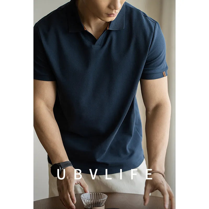 Man's blue short-sleeved cotton blend polo shirt with a collar, regular fit for summer.