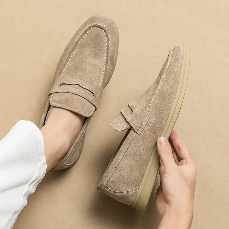 Men's beige leather slip-on casual shoes with a round toe and rubber sole on a white background