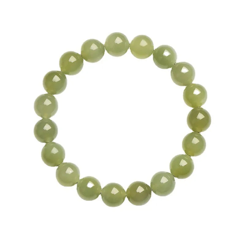 Polished Hetian jade ball bracelet in ice-like clear water colours on a wrist.