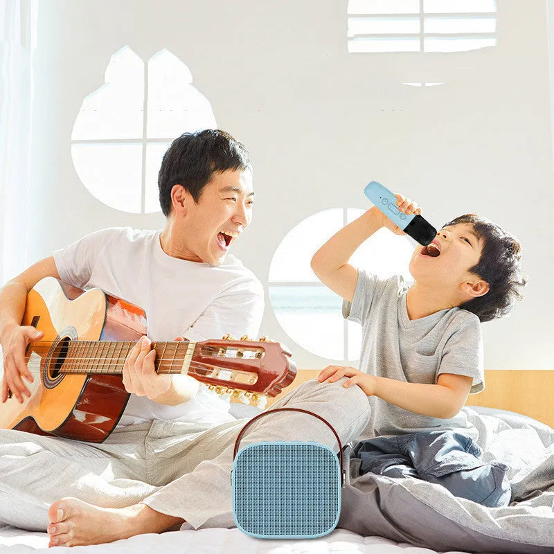 Compact portable Bluetooth speaker in blue, pink, or white with built-in microphone and USB charging cable