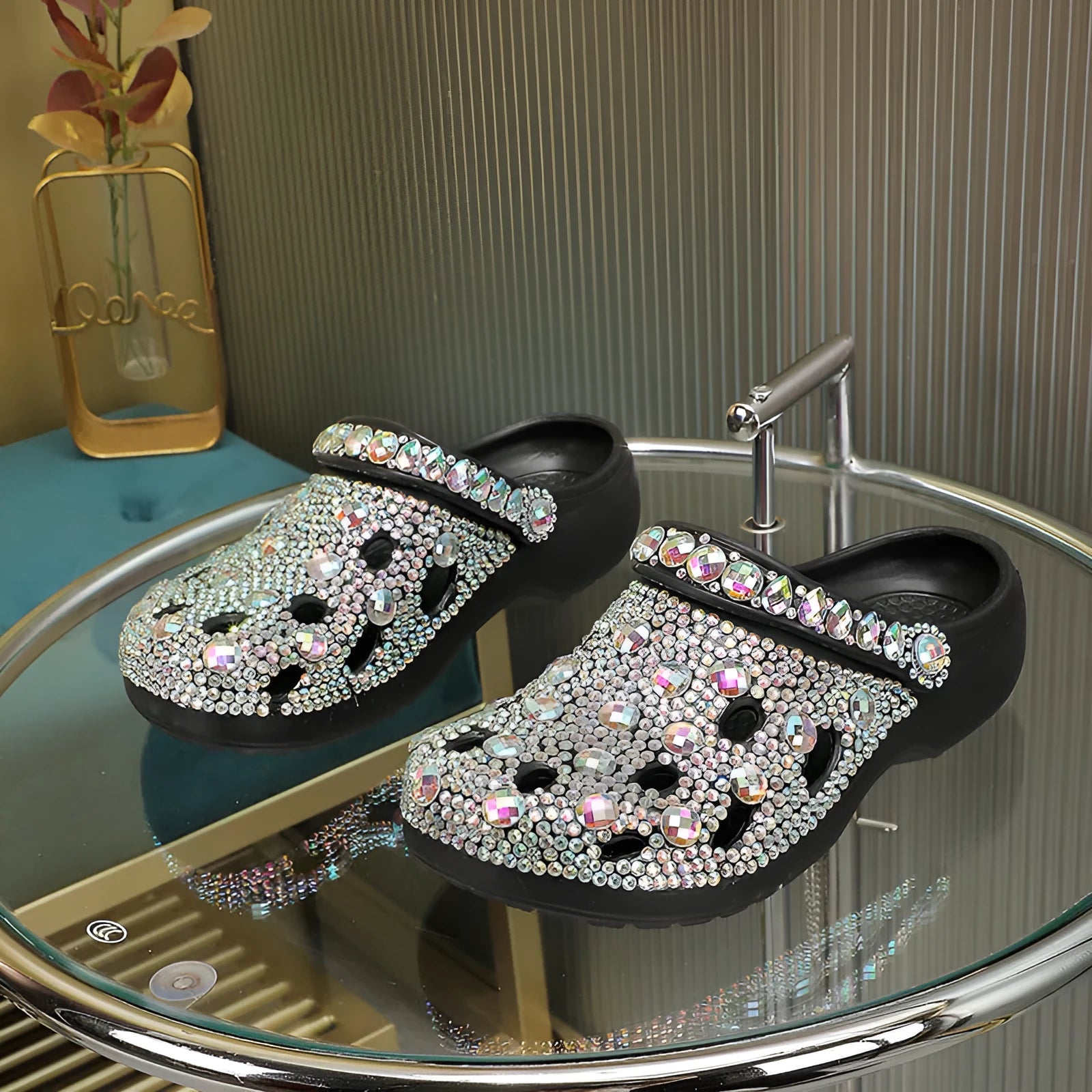 Black women's platform sandals with rhinestone detailing and a hole shoe design on an EVA sole.
