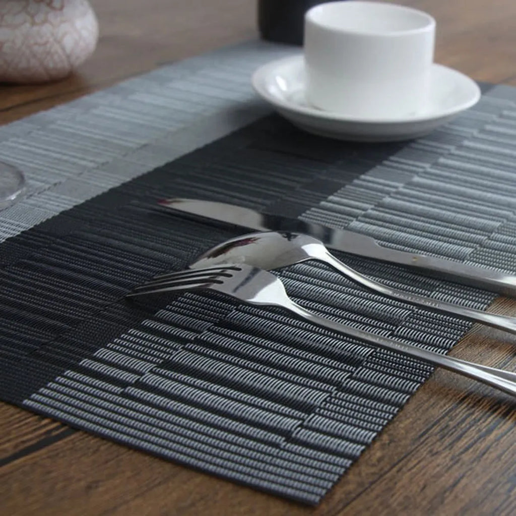 PVC non-slip placemat in gradient bamboo design protecting a kitchen countertop.
