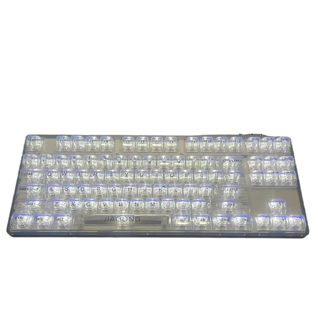 Transparent plastic keyboard key caps arranged as complete 132-key set for mechanical keyboard replacement