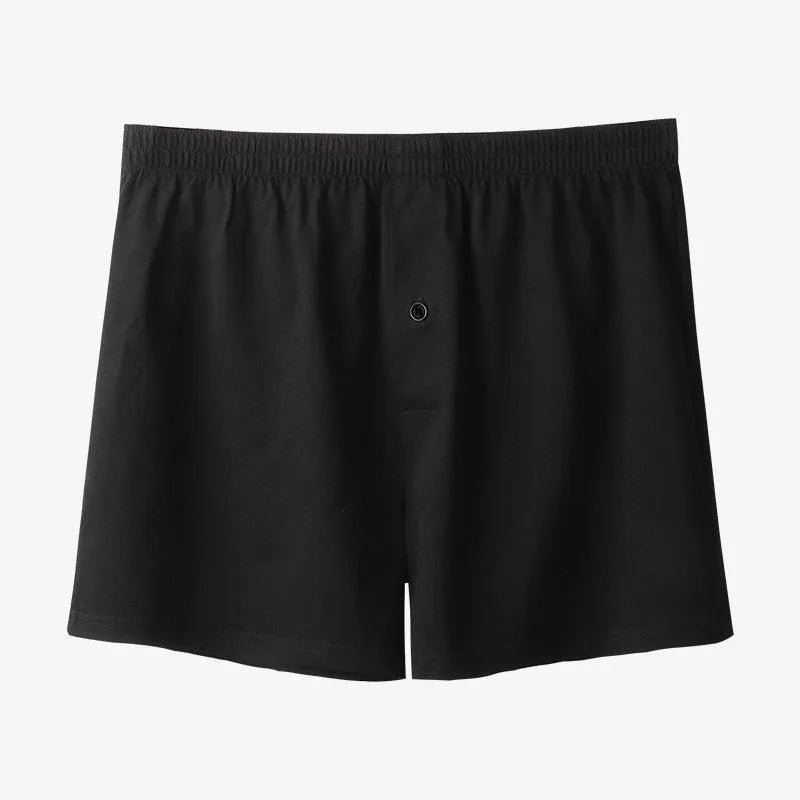 Men's solid colour cotton boxer shorts with a high waist and loose fit.
