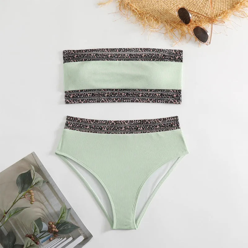 Black strapless bikini top and briefs swimsuit set with leopard pattern splicing.