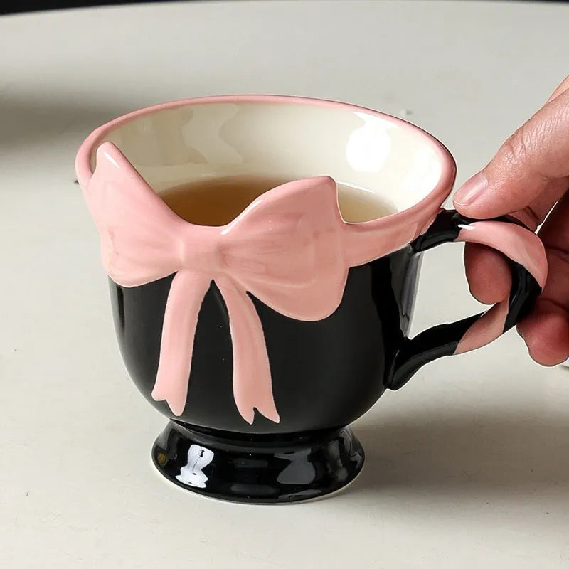 Ceramic mug with a girl heart bow design in white powder and black pink colour options