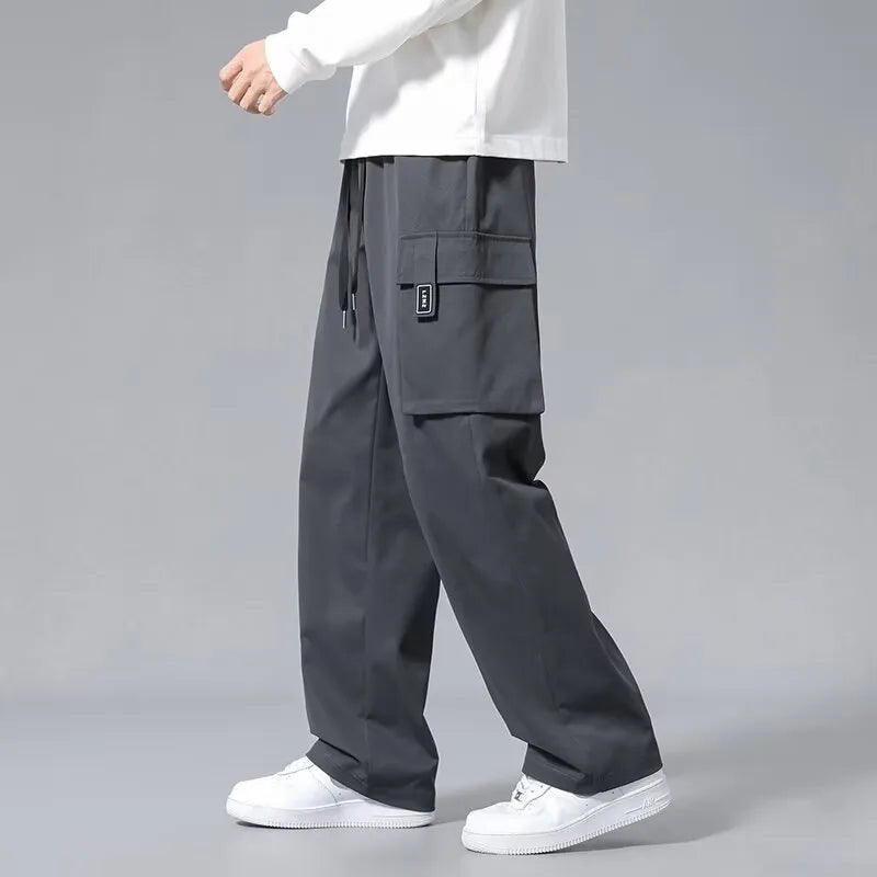 Boys straight leg cargo trousers with drawstring waist and large pockets in polyester fabric