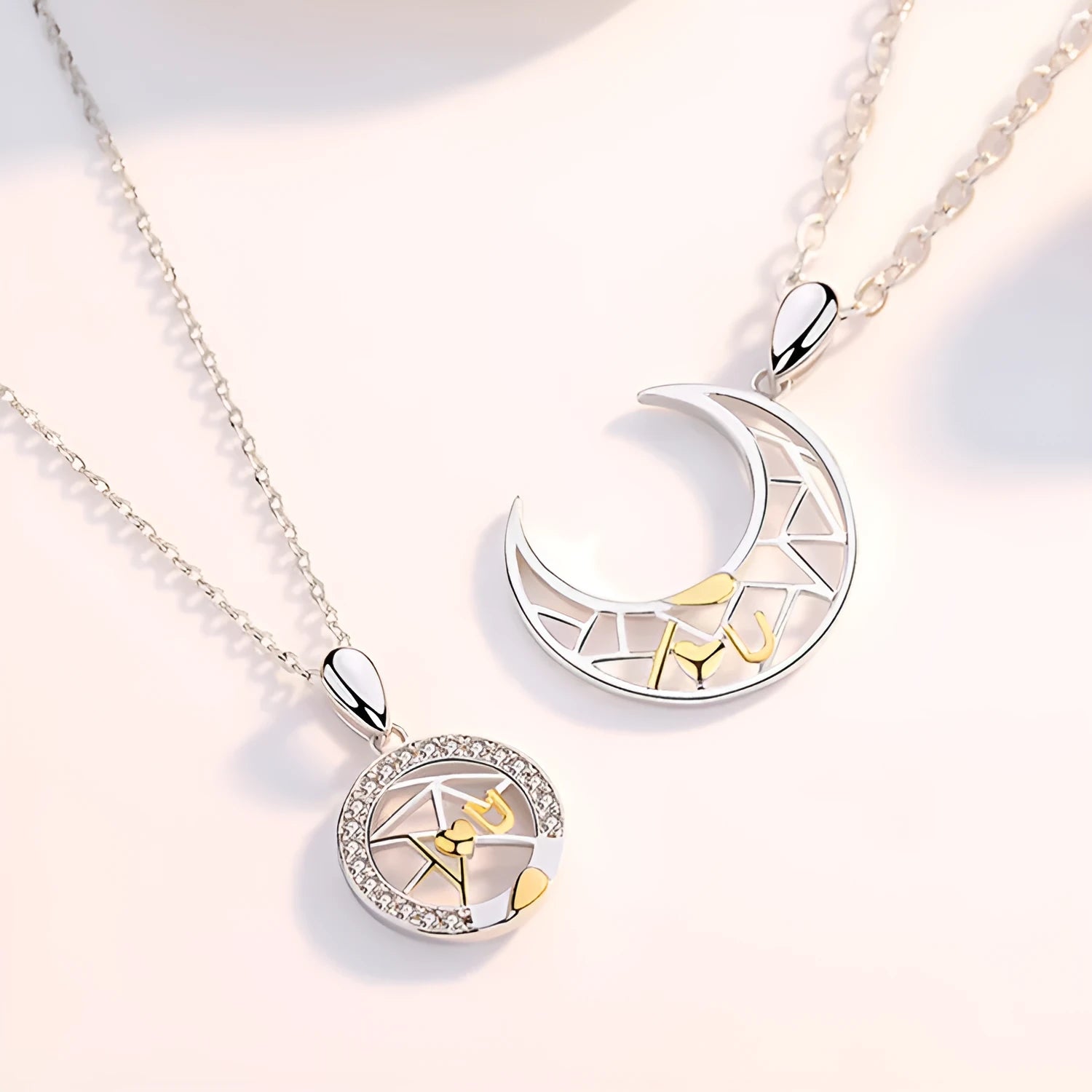 Sun and moon couple necklace with copper pendant on cross chain, showing male and female colour options