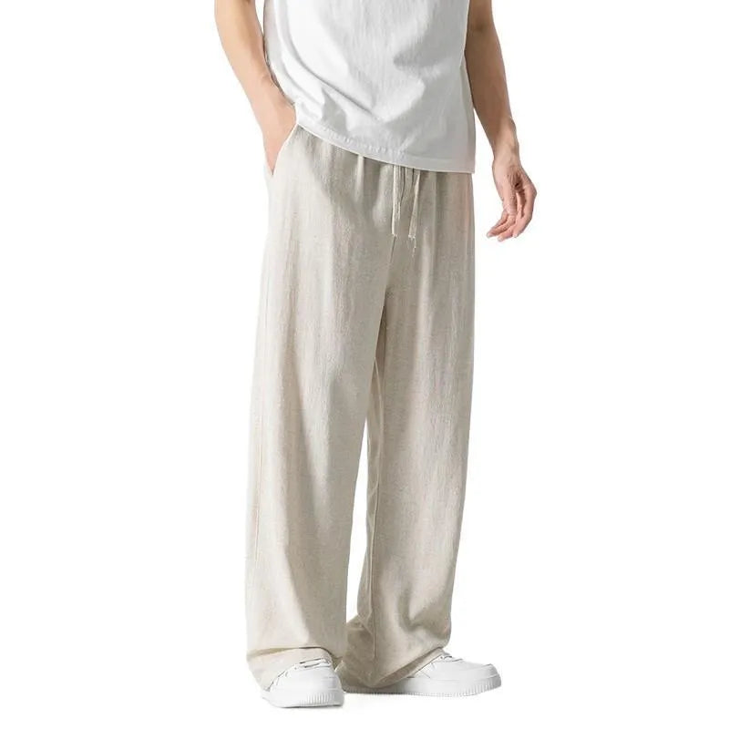 Men's light beige bamboo fibre straight-leg trousers with cropped length and drawstring waist on hanger