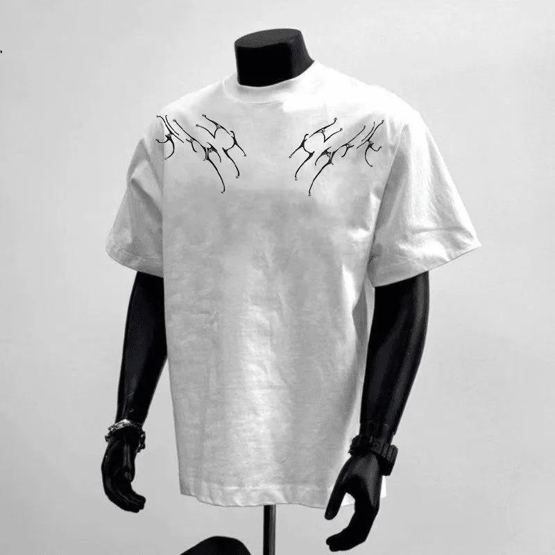 Man wearing a loose-fit black cotton T-shirt with a white printed letter design on the front.
