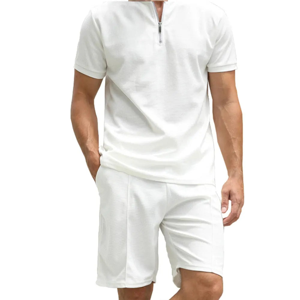 Men's solid colour polo shirt and trouser two-piece set in beaded bird's eye polyester fabric.