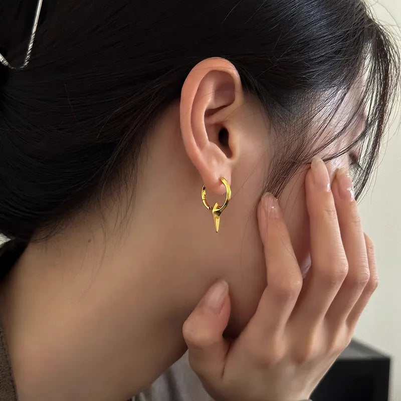 Women's platinum-coloured geometric star ear clips with a white gold plated finish.