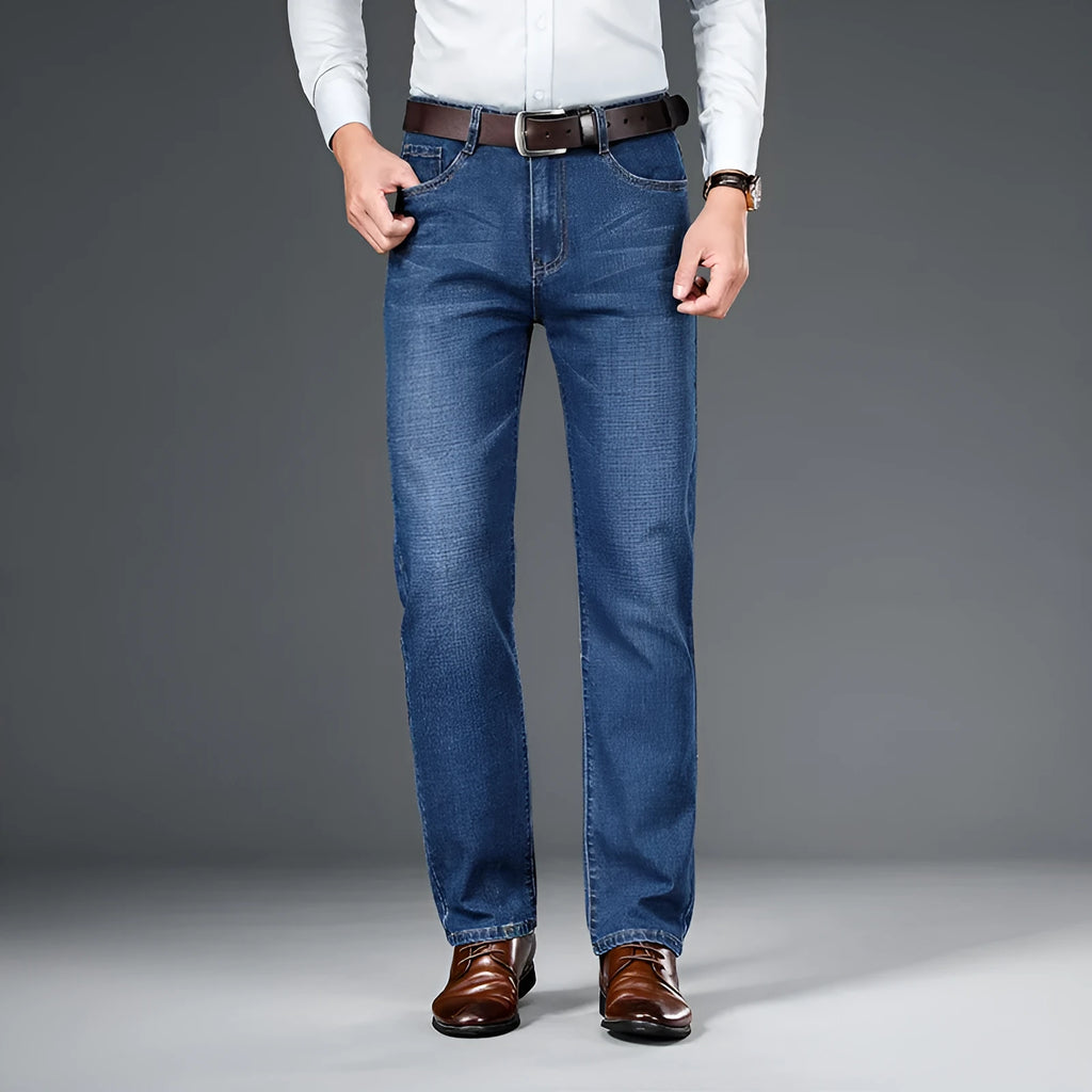 Men's straight loose elastic denim business trousers in dark blue colour, mid-waist straight-leg style on white background