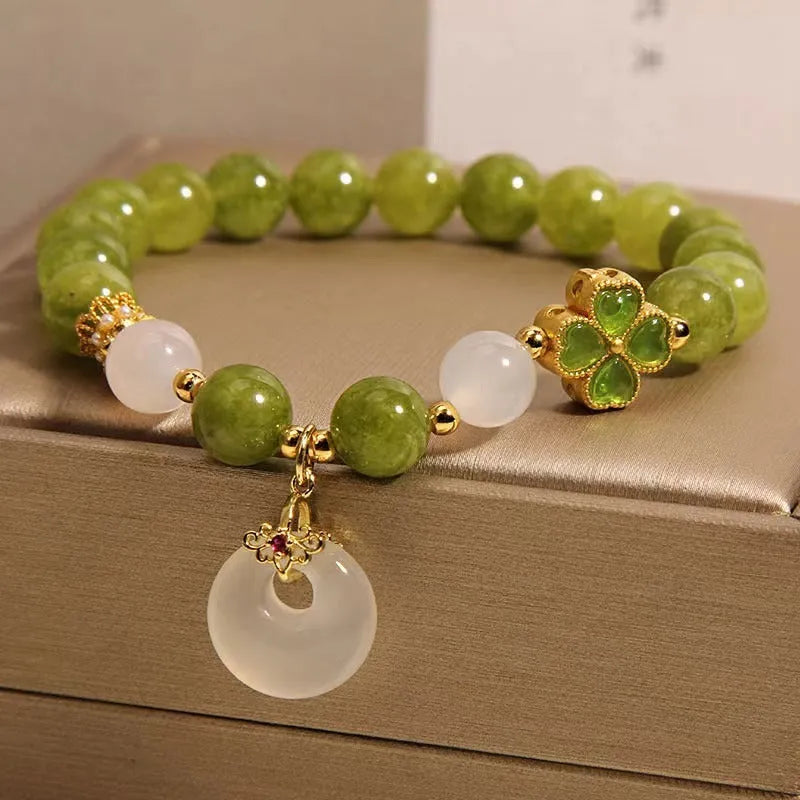 Green tourmaline four leaf clover women's bracelet with safety buckle, peace buckle, and lucky bag charm in New Chinese style.