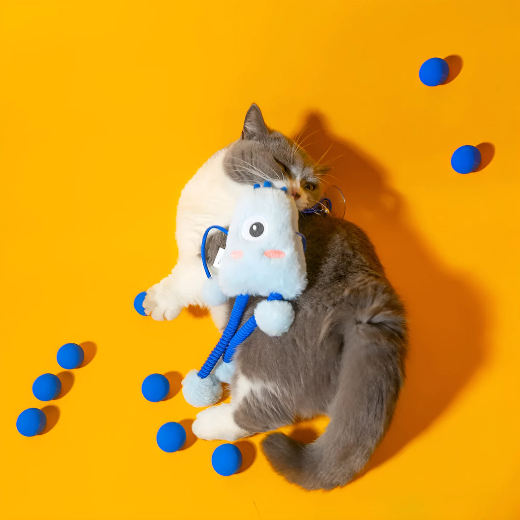 Blue plush cat toy ring with elastic rope and bell on a white background