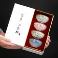 Four ceramic Kung Fu tea cups in a light colour gift box, new Chinese style household tea set.