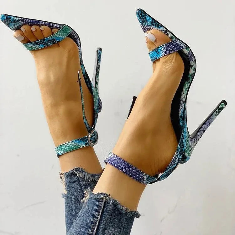 Blue serpentine strap high heels with buckle closure and pointed toe