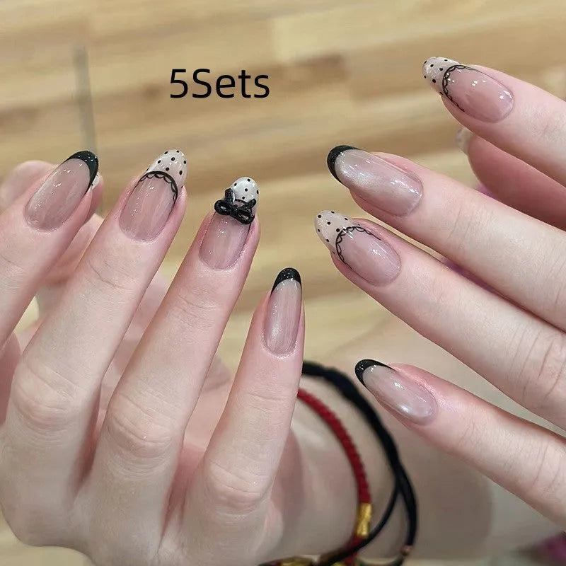 Pack of sweet girl style fake nails showing random colour designs in a set of ten.