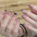 Pack of sweet girl style fake nails showing random colour designs in a set of ten.