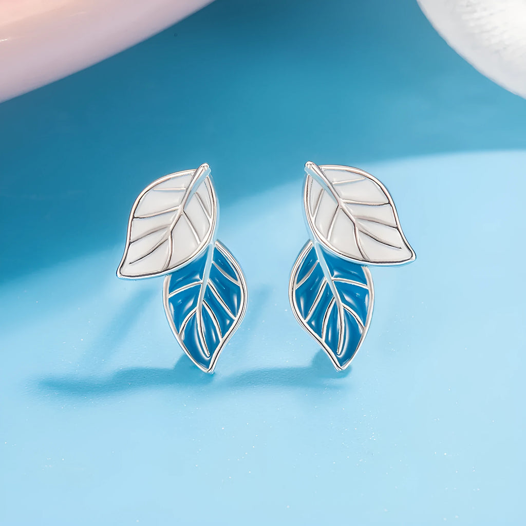 Copper leaf-shaped stud earrings with white gold colour plating and post fastening