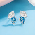 Copper leaf-shaped stud earrings with white gold colour plating and post fastening