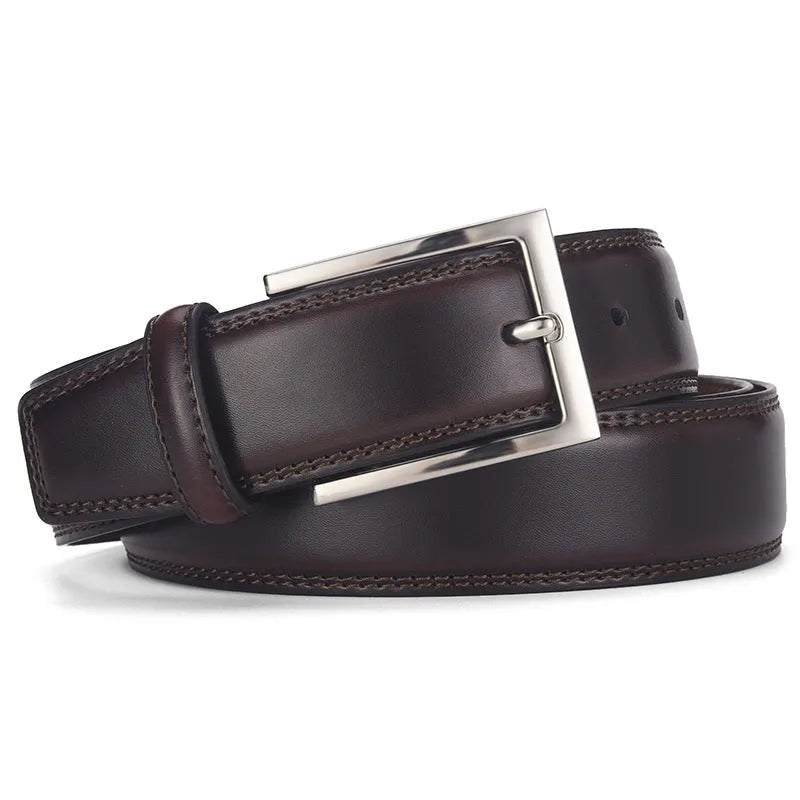 Men's black leather belt with a silver alloy pin buckle laid flat, showing its length and width.