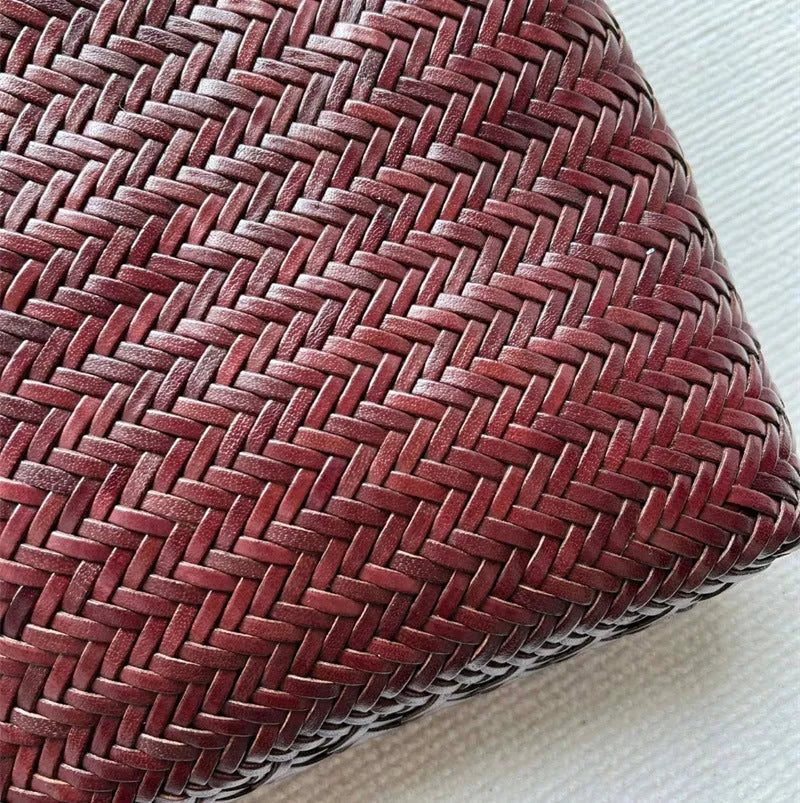 Handmade woven brown leather tote bag with three-dimensional pockets and vintage finish
