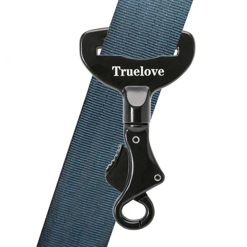 Black aluminium alloy dog car seat belt lock with 5cm tab resting on car seat