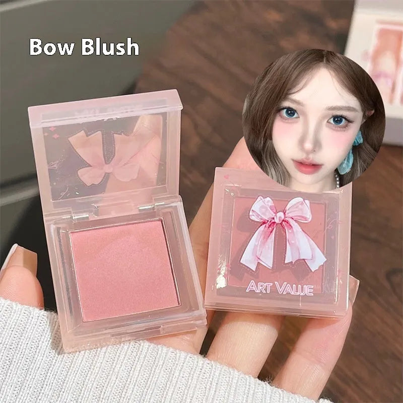 Butterfly Box makeup set with four pink lip mud containers, powder blusher, and necklace