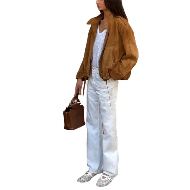 Man wearing a solid colour loose-fit long sleeve retro-style polyester jacket.