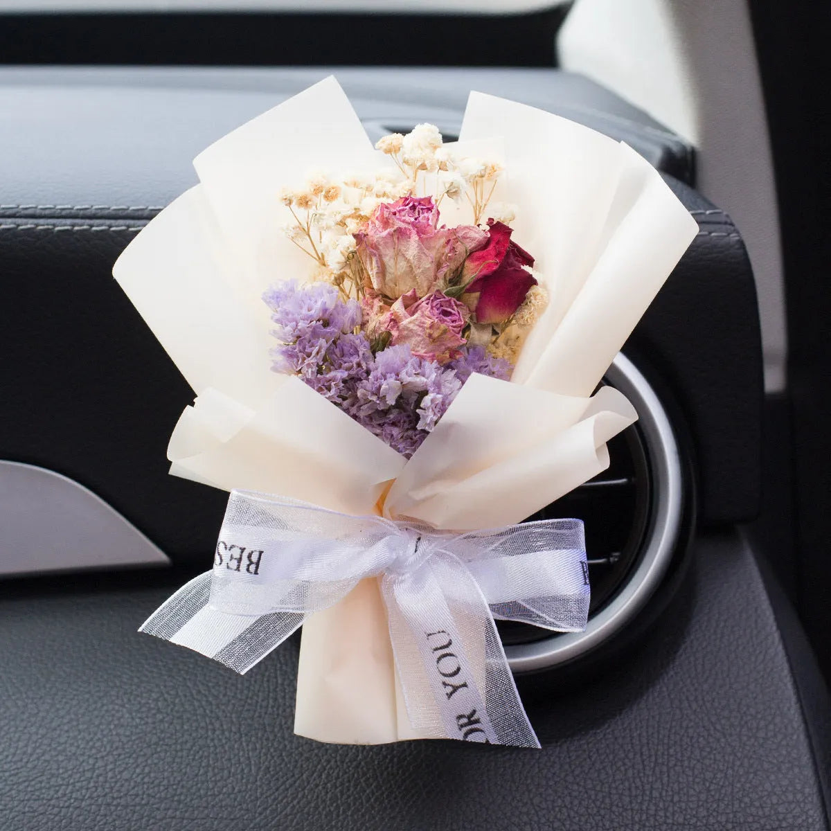 Handmade dried flower car air freshener ornament in multiple colours mounted on car vent