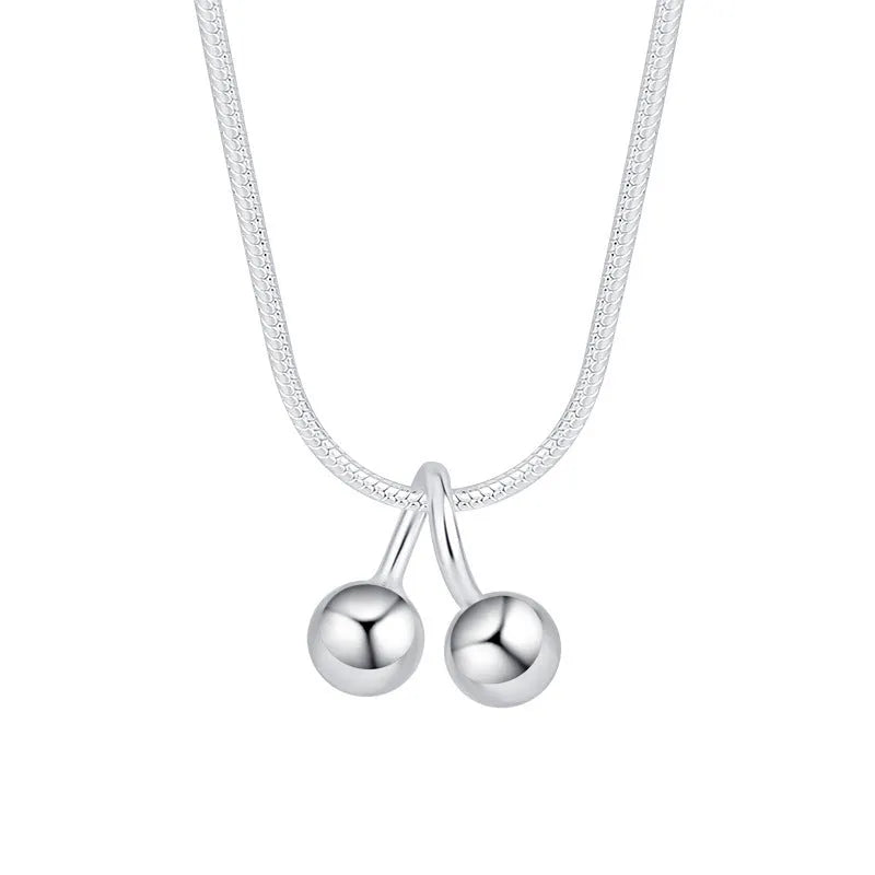Silver cherry necklace for women with adjustable snake bone chain and fruit-shaped pendant.